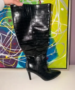 Black knee-high boots with crocodile texture